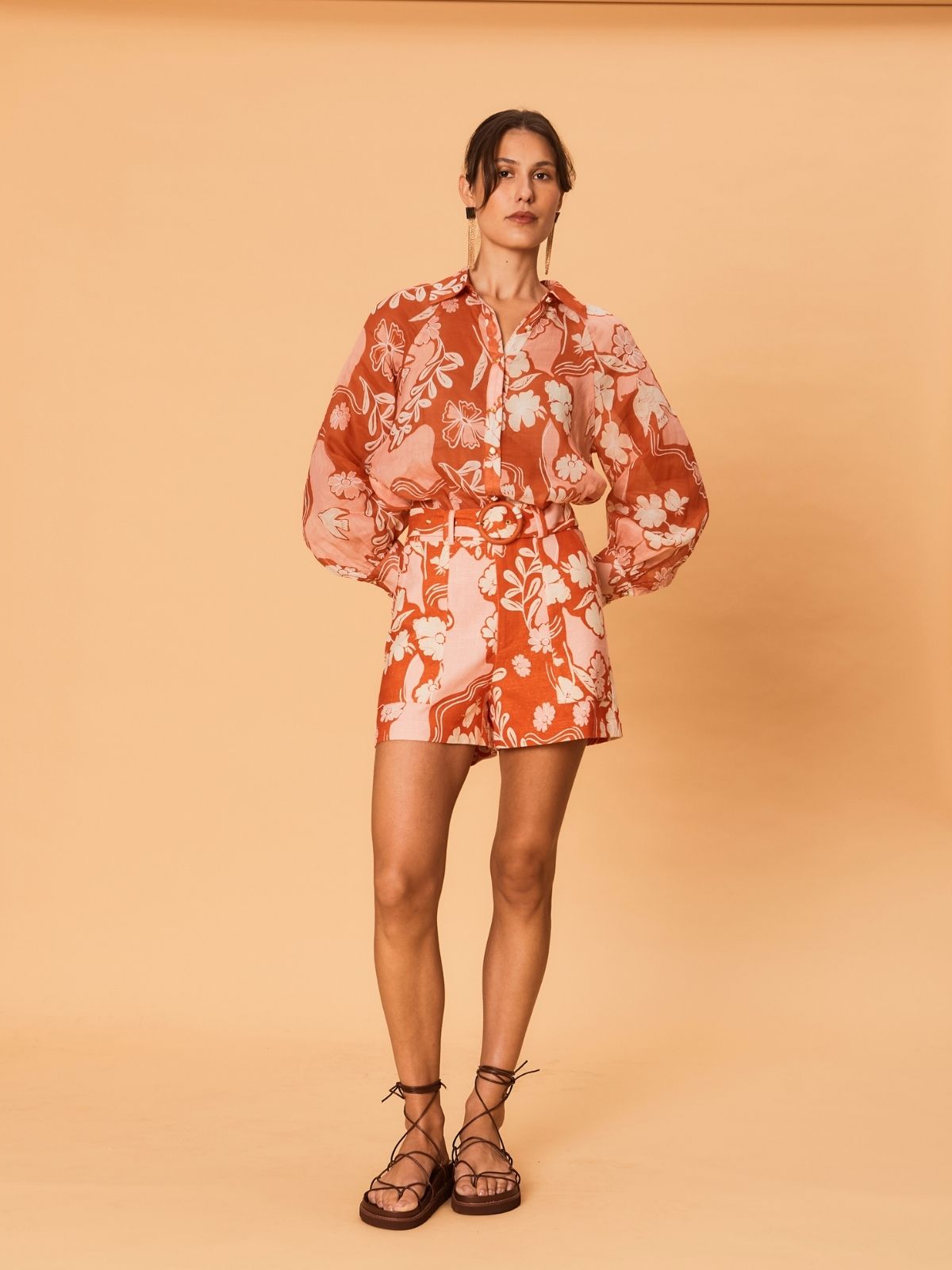 Front view of a model wearing the Akira Blouse by La Maise Studio, showing the collared neckline and long sleeves in bird floral ramie fabric.