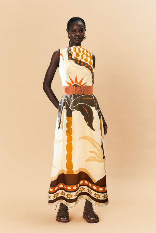 Model wearing a patterned La Maise blanc placement dress with a neutral background.