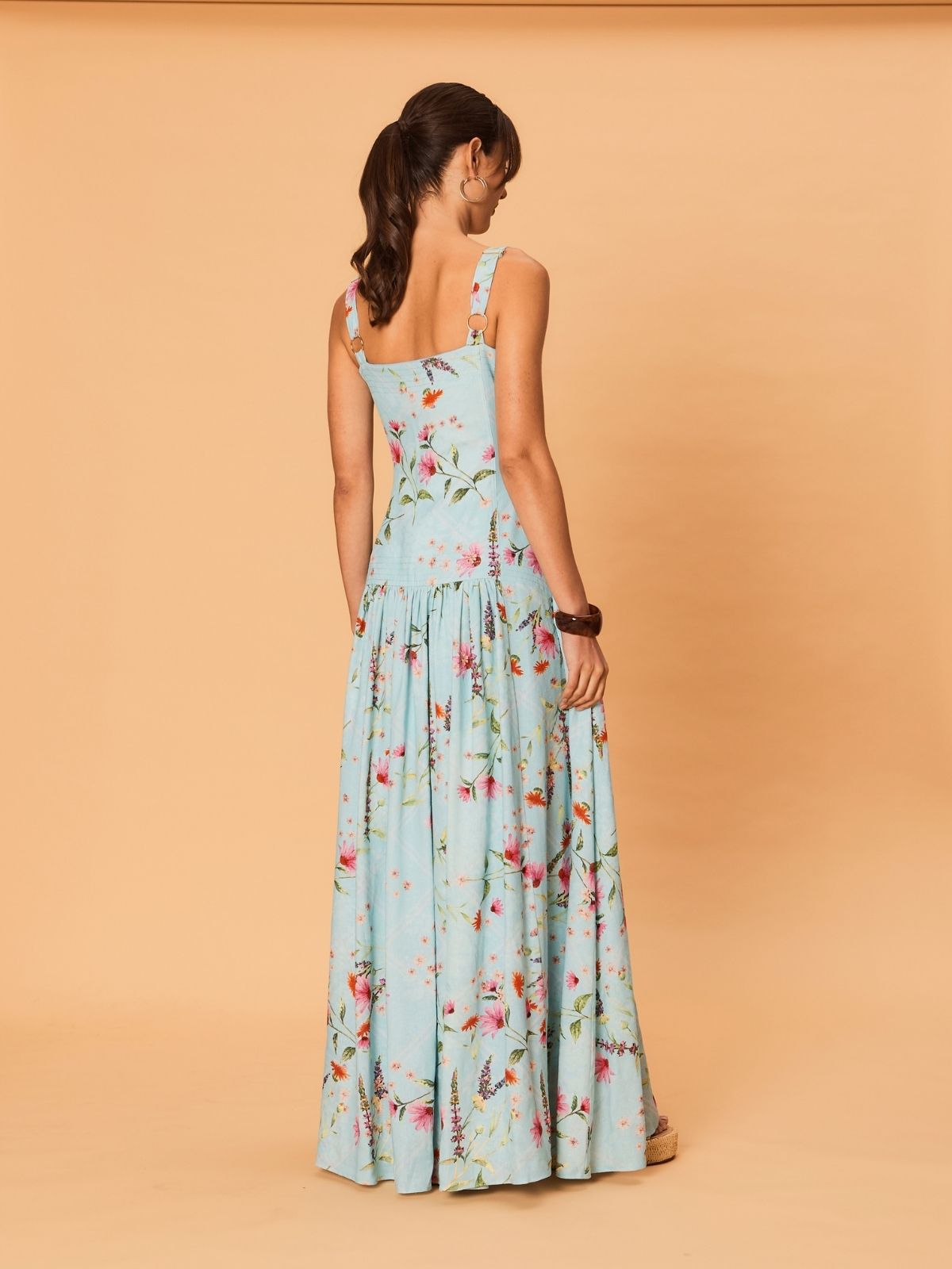 Back view of Diana Maxi Dress from La Maise Studio showing wide straps, fitted waist and flowing floral maxi skirt.
