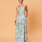 Model wearing La Maise Diana Maxi Dress in delicate floral print with square neckline, wide straps and fitted bodice.