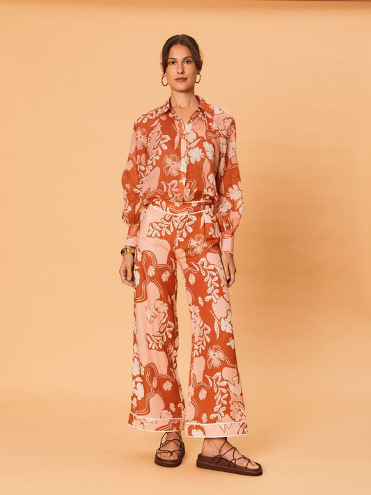 Back view of a model wearing the Akira Pant – Bird Floral by La Maise Studio, showing the relaxed wide-leg fit and flowing Tencel linen fabric.