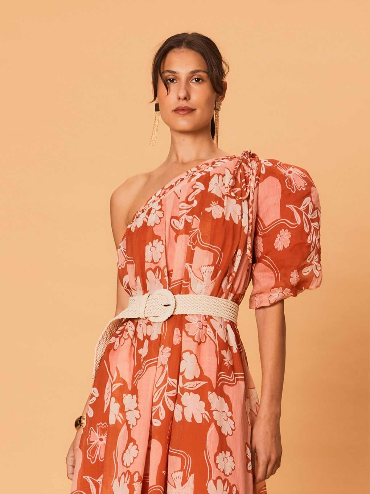 A model shown from the side wearing the La Maise Studio Akira One Shoulder Dress, highlighting the draped one-shoulder design, lightweight ramie fabric, and relaxed fit.